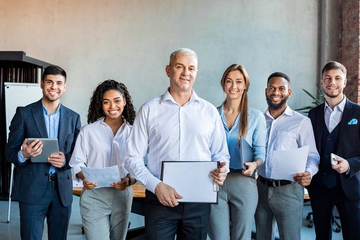 group of colleagues smiling to camer