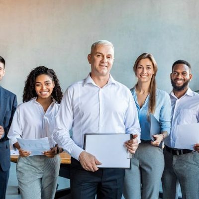 group of colleagues smiling to camer
